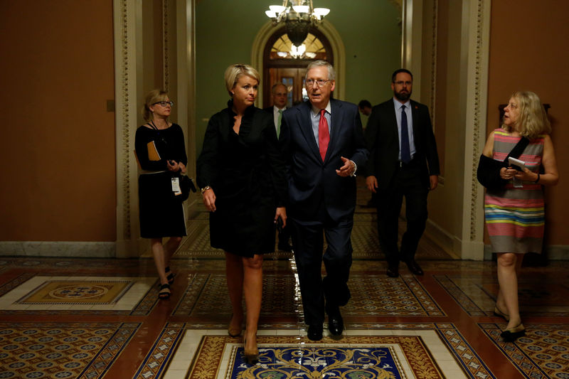 © Reuters. McConnell walks with an aide as he returns to his office from the Senate floor at the U.S. Capitol in Washington