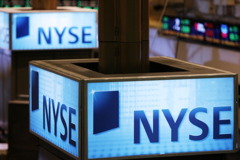 © Reuters. Signs can be seen above the floor of the New York Stock Exchange