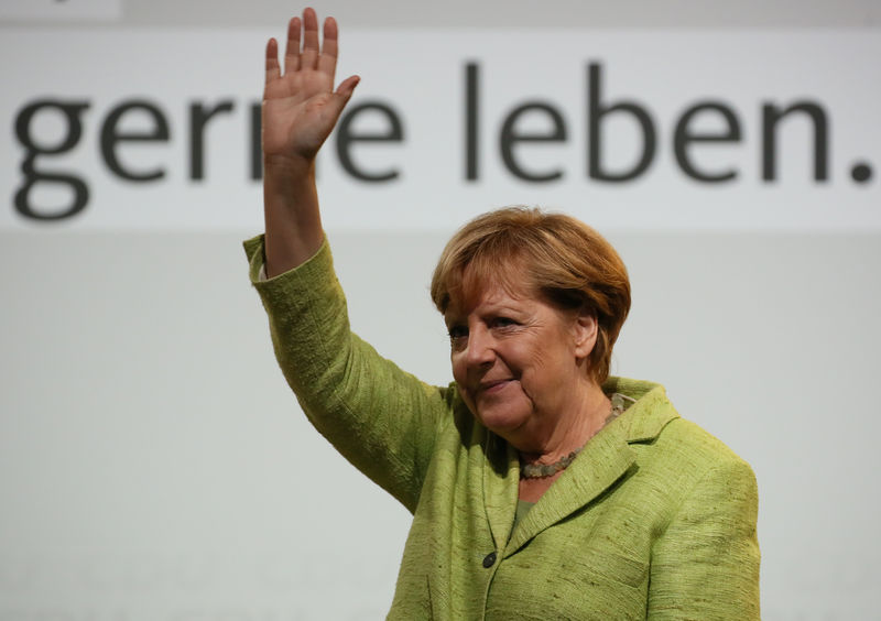 © Reuters. German Chancellor Angela Merkel, a top candidate of the Christian Democratic Union Party (CDU) for the upcoming general elections campaigns in Finsterwalde