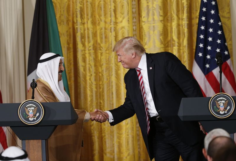 © Reuters. U.S. President Trump greets Emir of Kuwait Sabah Al-Ahmad Al-Jaber Al-Sabah during a joint news conference at the White House in Washington