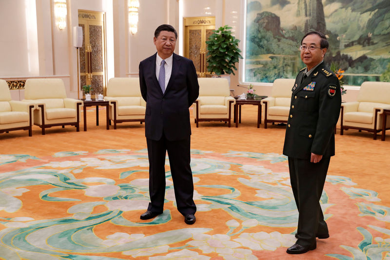 © Reuters. FILE PHOTO: Chinese President Xi Jinping and Gen. Fang Fenghui in Beijing