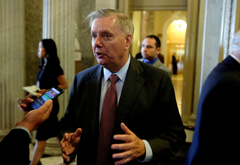 © Reuters. FILE PHOTO - Senator Lindsey Graham (R-SC) speaks to reporters before the Senate approved $15.25 billion in aid for areas affected by Hurricane Harvey in Washington