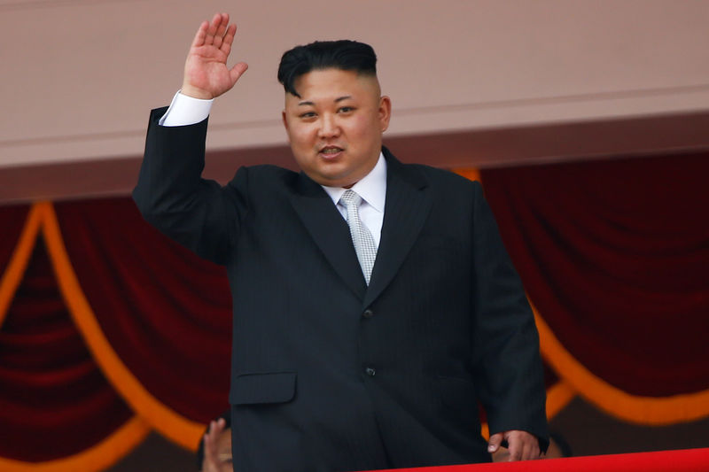 © Reuters. FILE PHOTO:North Korean leader Kim Jong Un waves to people attending a military parade marking the 105th birth anniversary of country's founding father, Kim Il Sung in Pyongyang
