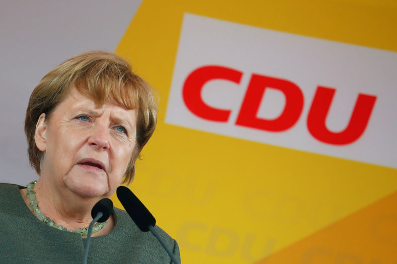 © Reuters. German Chancellor Angela Merkel reacts during a speech as she campaigns in Barth