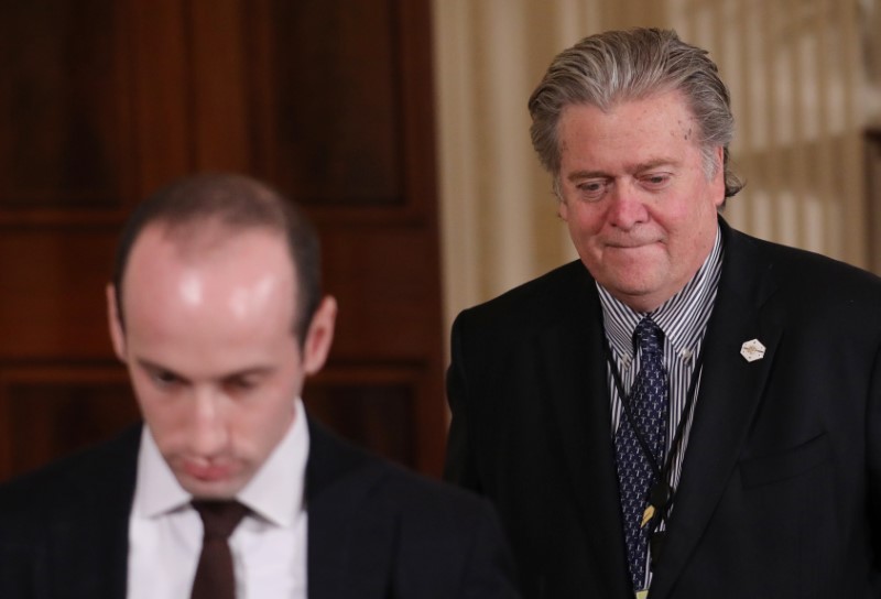 © Reuters. White House aides Bannon and Miller arrive for news conference by U.S. President Trump at the White House in Washington