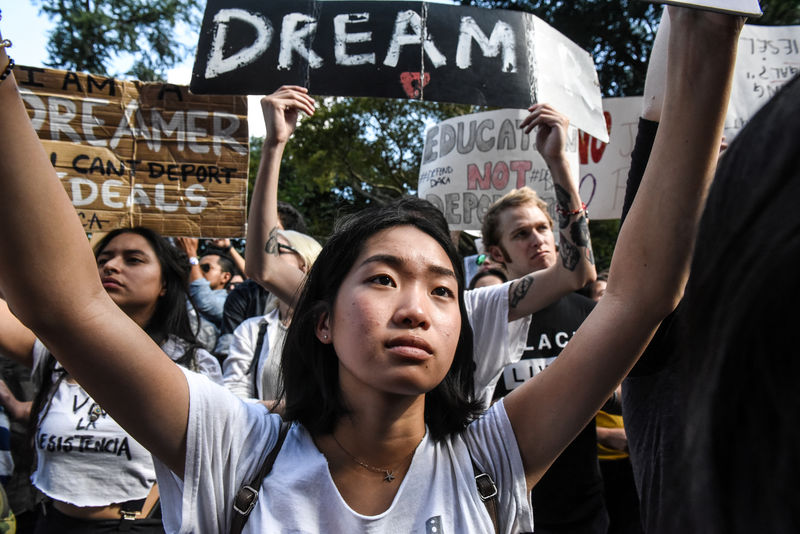 © Reuters. People participate in a protest in defense of the Deferred Action for Childhood Arrivals program or DACA in New York, NY