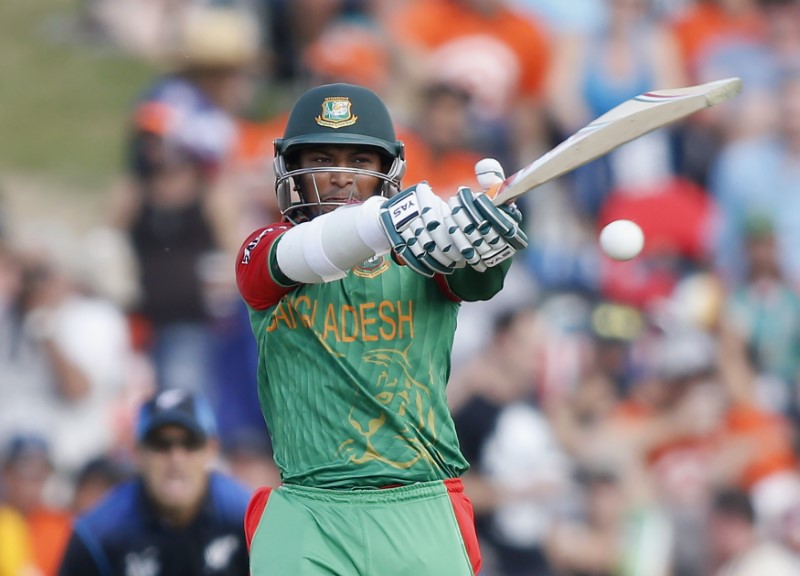 © Reuters. Bangladesh's Shakib Al Hasan hits out during their Cricket World Cup match against New Zealand in Hamilton