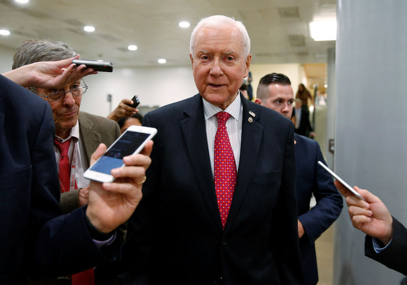 © Reuters. Senator Orrin Hatch (R-UT) speaks to reporters after the Senate approved $15.25 billion in aid for areas affected by Hurricane Harvey in Washington