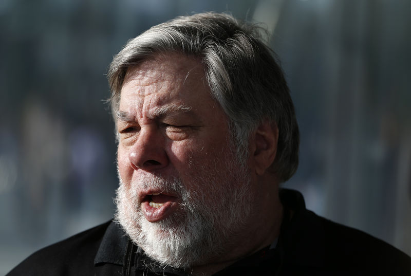 © Reuters. Steve Wozniak, co-founder of Apple, talks to people during a launch event in Cupertino