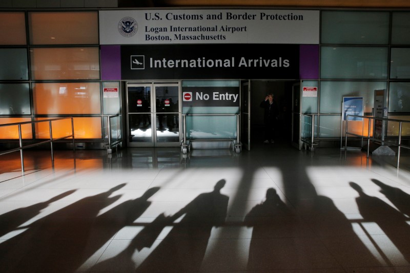 © Reuters. An international traveler arrives after U.S. President Donald Trump's executive order travel ban at Logan Airport in Boston