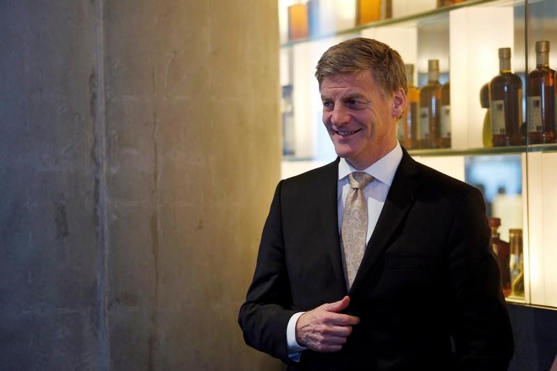 © Reuters. FILE PHOTO: New Zealand Prime Minister Bill English attends an event at a restaurant in Hong Kong