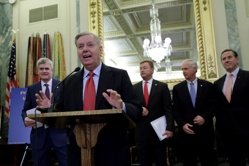 © Reuters. Senators Bill Cassidy, MD (R-LA), Lindsey Graham (R-SC), Dean Heller (R-NV), Ron Johnson (R-WI) and former Senator Rick Santorum hold a joint news conference
