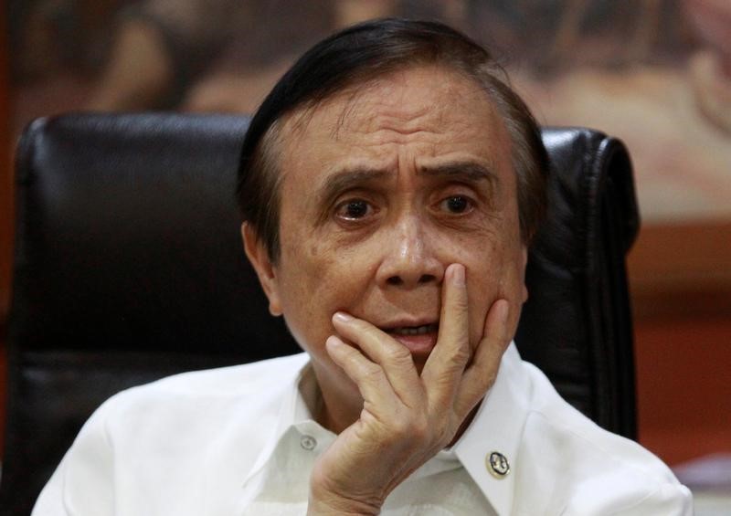 © Reuters. Economic Planning Secretary Ernesto Pernia listens during an interview with Reuters in Manila