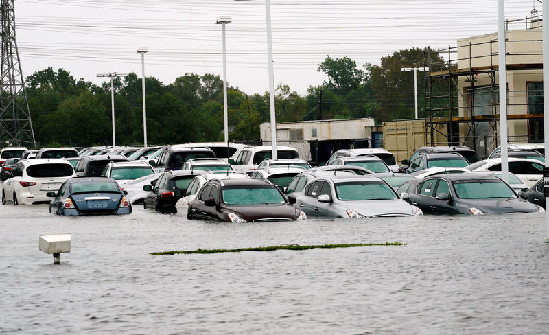 © Reuters. FILE PHOTO: A car dealership is covered by Hurricane Harvey floodwaters near Houston