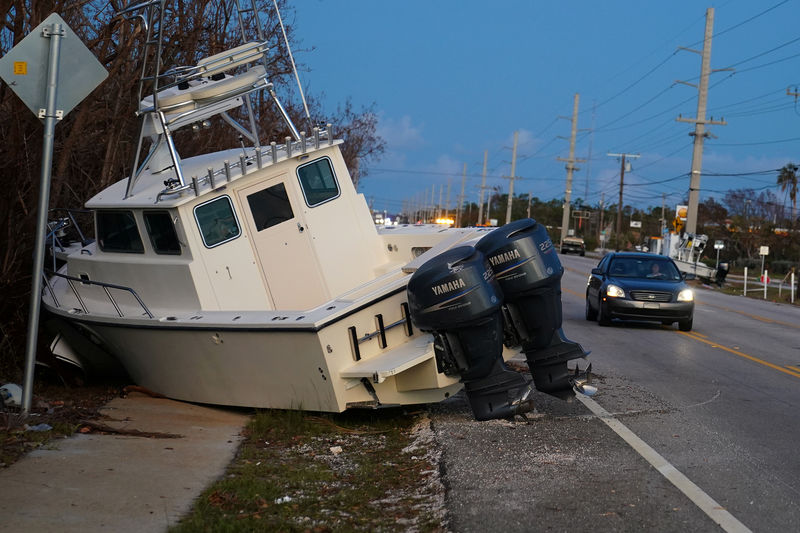 © Reuters. A boat lays across US 1 after Hurricane Irma in Big Pine Key, Florida