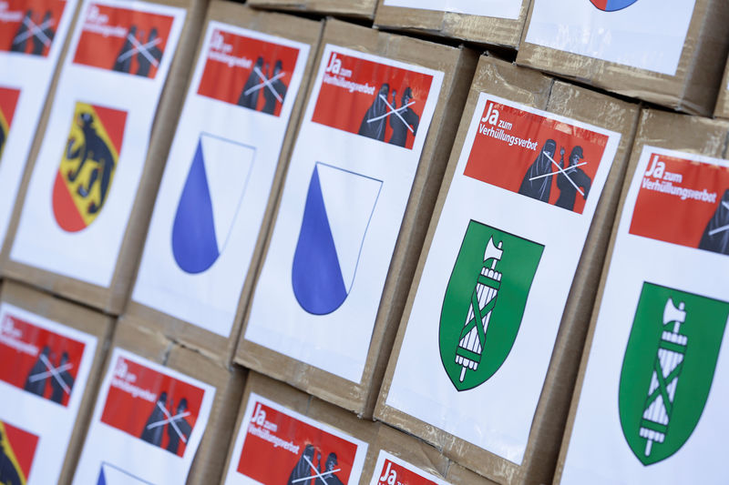 © Reuters. Boxes from initiative committee for "Yes to a Mask Ban" with signatures in Bern