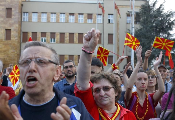 © Reuters. Protesters demonstrate in front of the parliament in Skopje