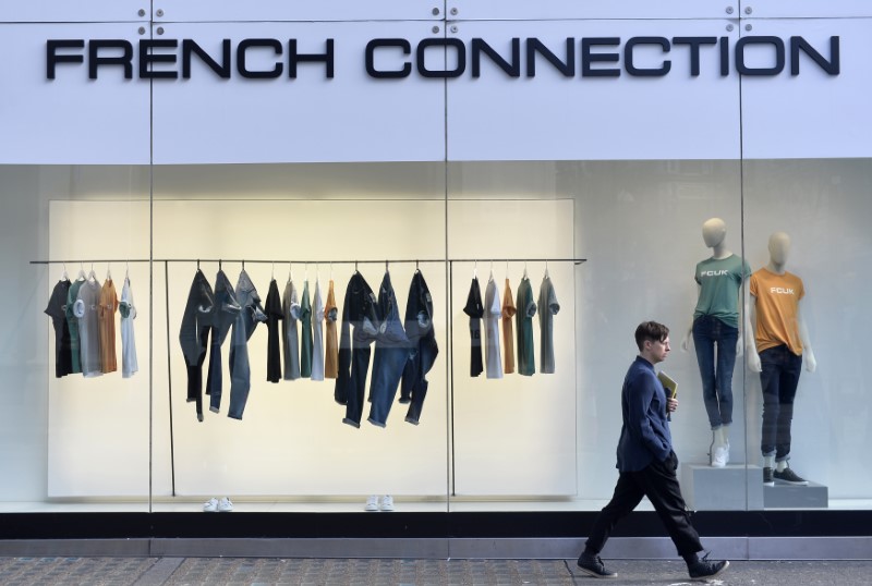 © Reuters. A person walks past a French Connection store in London, Britain