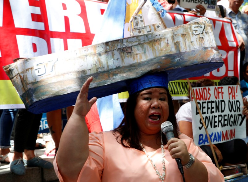 © Reuters. Activist and actress Paner speaks outside the Chinese Consulate during a protest over the South China Sea disputes by different activist groups in Makati City