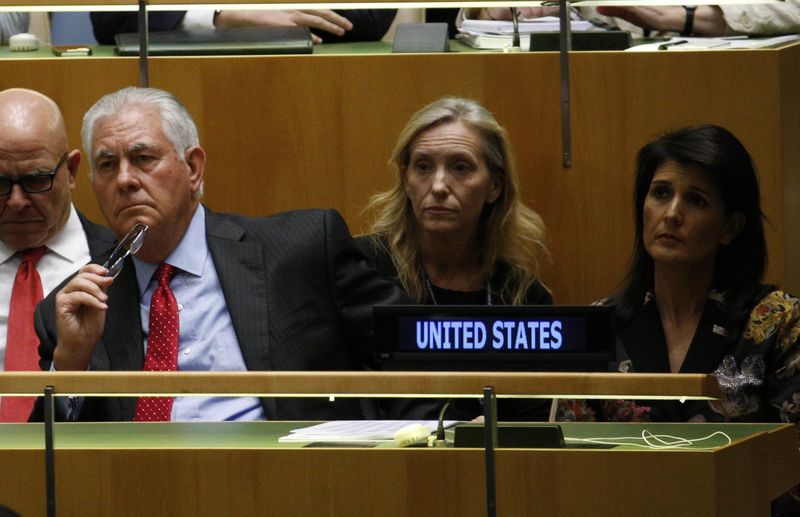 © Reuters. U.S. officials listen as U.S. President Trump addresses the 72nd United Nations General Assembly at U.N. headquarters in New York