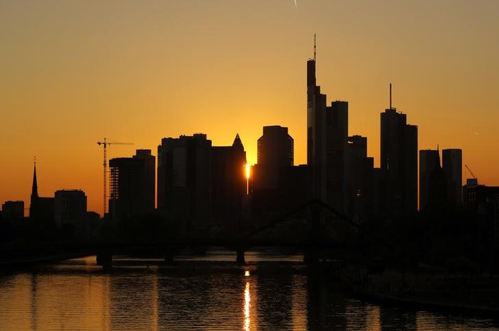 © Reuters. The skyline with its characteristic banking towers is pictured during sun down after a sunny spring day in Frankfurt