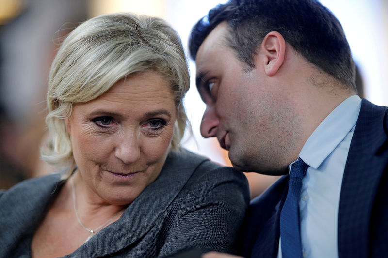 © Reuters. FILE PHOTO - France's far-right National Front (FN) leader Marine Le Pen and vice-president Florian Philippot attend a FN political debate in Paris