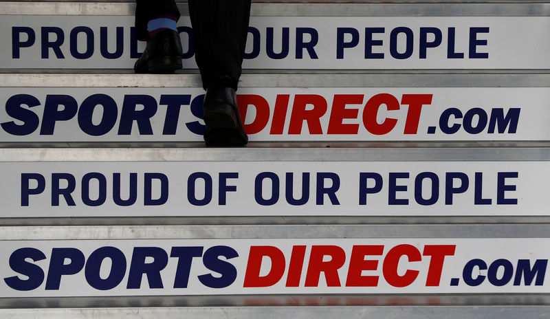 © Reuters. A man arrives for Sports Direct AGM at their headquarters in Shirebrook