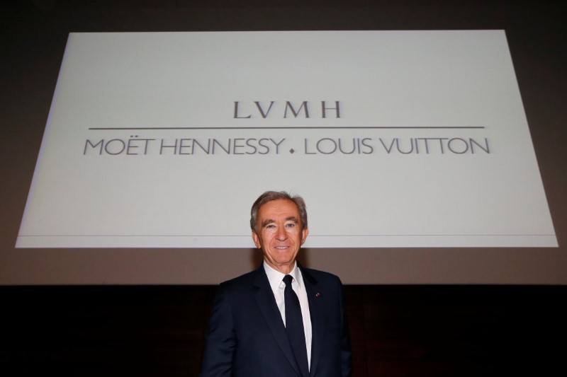 © Reuters. FILE PHOTO - Chairman and CEO of Luxury goods group LVMH Bernard Arnault poses after a news conference, to announce a deal to simplify Christian Dior business structure, in Paris