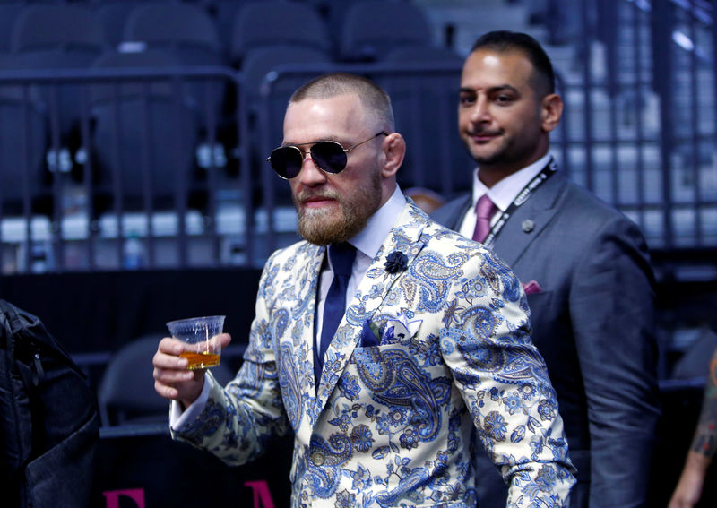 © Reuters. UFC lightweight champion Conor McGregor of Ireland arrives for a post-fight news conference at T-Mobile Arena in Las Vegas