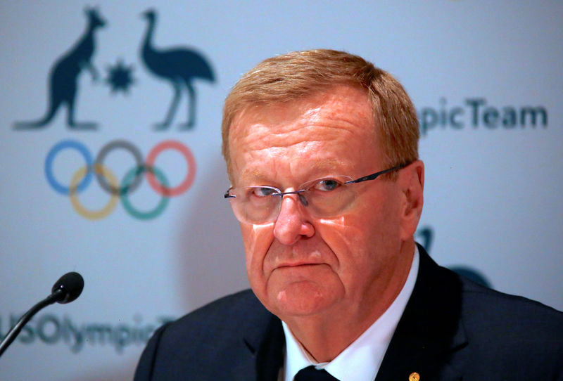 © Reuters. John Coates, President of the Australian Olympic Committee, listens to a question during a media conference in Sydney, Australia