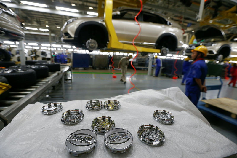 © Reuters. FILE PHOTO: Logos of BYD for tyres are seen at an assembly line in Shenzhen