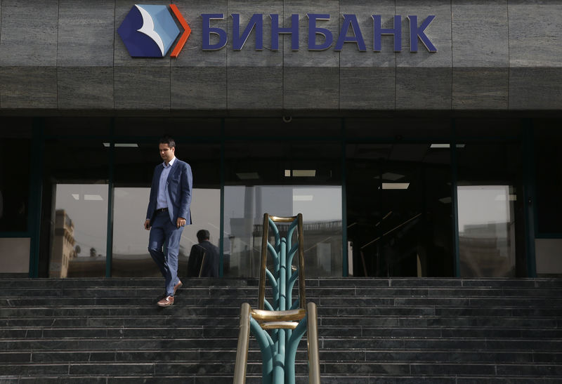 © Reuters. A man walks down the stairs at the Russia's B&N Bank headquarters in central Moscow