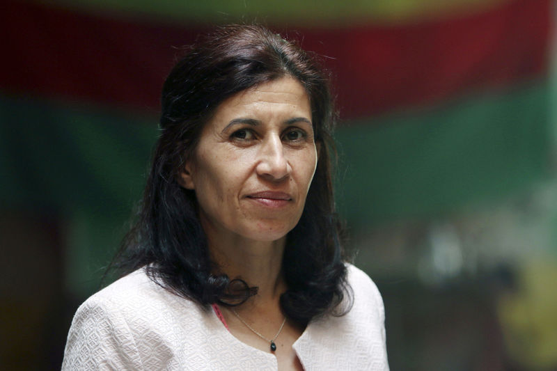 © Reuters. FILE PHOTO:Hadiya Yousef, a Kurdish politician and chairwoman of the founding assembly of a new federal system of government for northern Syria, poses in Hasaka