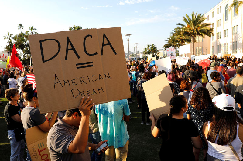 © Reuters. Alliance San Diego hold a protest rally in front of San Diego County Administration Center