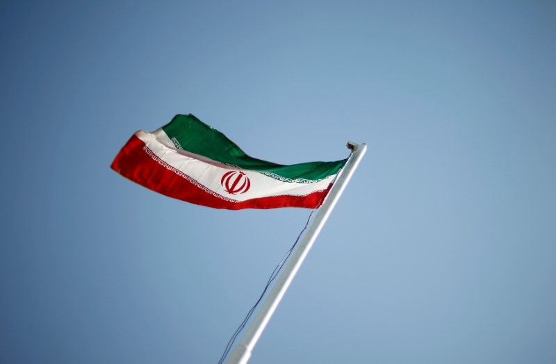 © Reuters. FILE PHOTO -  An Iranian national flag during the opening ceremony of the 16th International Oil, Gas & Petrochemical Exhibition (IOGPE) in Tehran