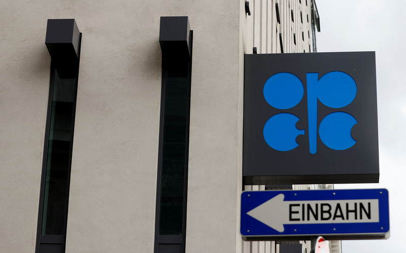© Reuters. The OPEC logo is pictured behind a traffic sign at its headquarters in Vienna