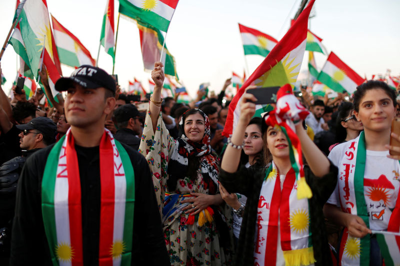 © Reuters. Kurds celebrate to show their support for the upcoming September 25th independence referendum in Erbil