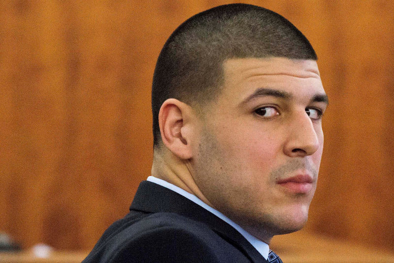© Reuters. FILE PHOTO - Former NFL player Aaron Hernandez looks at the gallery during the murder trial at the Bristol County Superior Court in Fall River