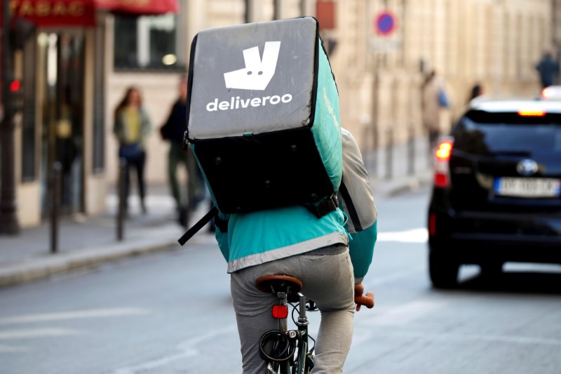 © Reuters. FILE PHOTO: A cyclist rides a bicyle as he delivers food for Deliveroo, an example of the emergence of what is known as the 'gig economy', in Paris