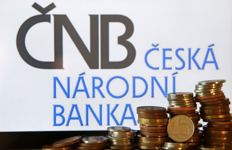 © Reuters. Czech Crown coins are seen in front of a displayed logo of Czech central bank (CNB) in this picture illustration