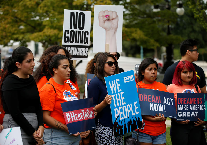 © Reuters. Immigration activists and DACA recipients take part in a rally about the importance of passing a clean DREAM Act before delivering a million signatures to Congress on Capitol Hill in Washington