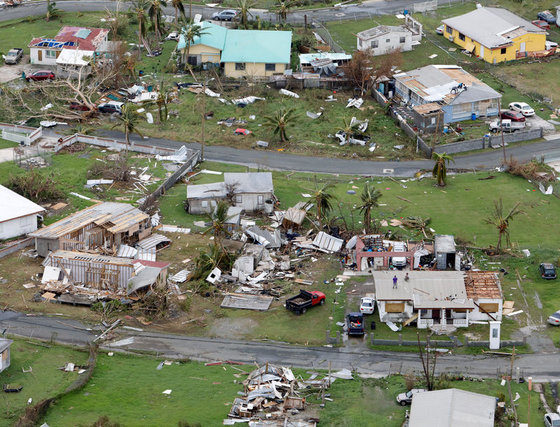 © Reuters. A badly damaged neighborhood is seen from a Marine Corps MV-22 Osprey surveying the aftermath from Hurricane Maria in St. Croix U.S. Virgin Islands