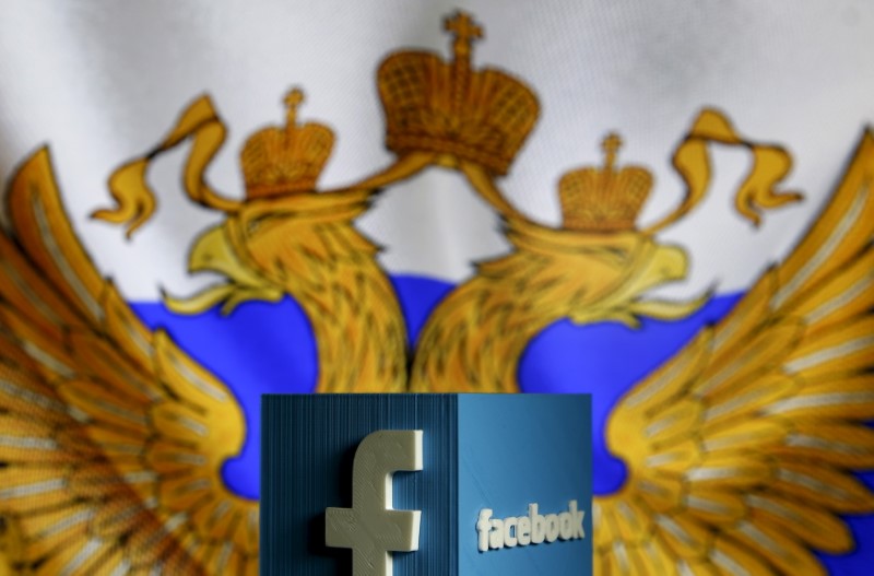 © Reuters. A 3D model of the Facebook logo is seen in front of a Russian flag in this photo illustration taken in Zenica