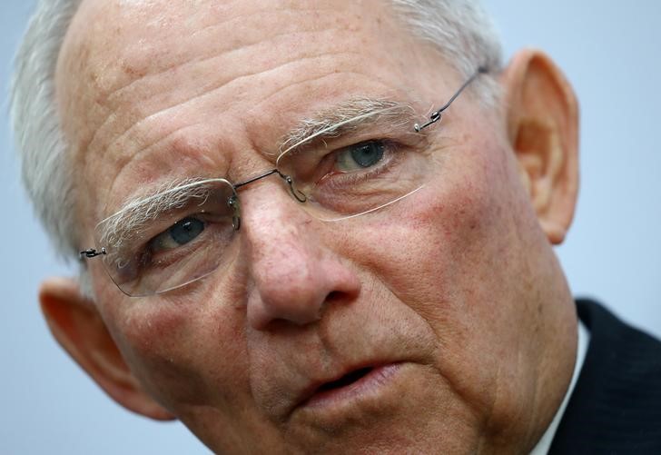 © Reuters. FILE PHOTO: German Finance Minister Wolfgang Schaeuble talks to reporters during the G20 Finance Ministers and Central Bank Governors Meeting in Baden-Baden