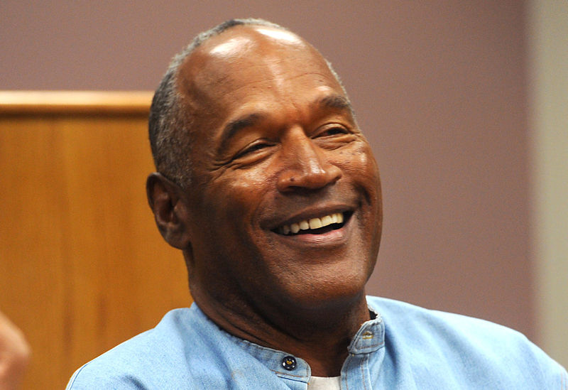 © Reuters. FILE PHOTO: O.J. Simpson reacts during his parole hearing at Lovelock Correctional Center in Lovelock