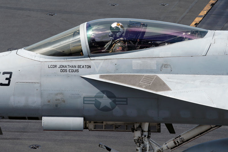 © Reuters. F/A-18 Super Hornet pilot is seen onboard USS Ronald Reagan in the South China Sea