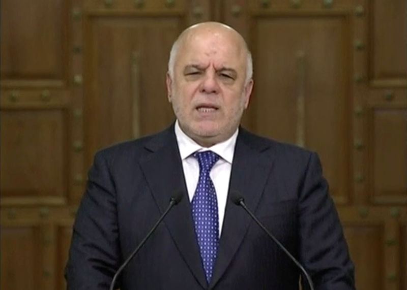 © Reuters. A still image taken from a video shows Iraqi Prime Minister Haider Al-Abadi speaking as he makes a statement in Baghdad