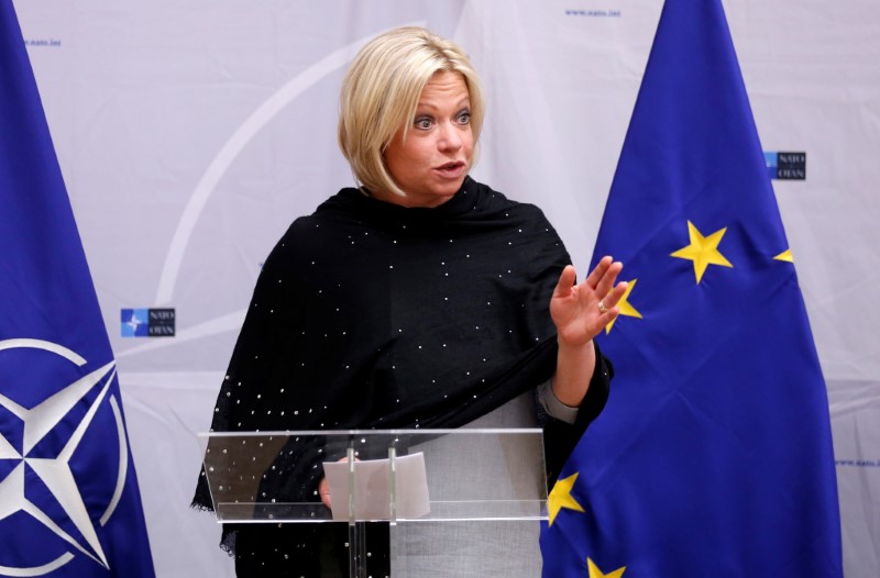 © Reuters. FILE PHOTO - Dutch Defence Minister Hennis-Plasschaert delivers a speech before signing european military cooperation agreements at the Alliance headquarters in Brussels