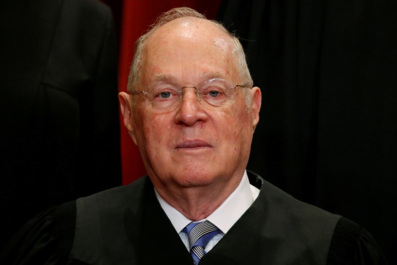 © Reuters. FILE PHOTO - Kennedy participates in taking a new family photo with fellow justices at the Supreme Court building in Washington