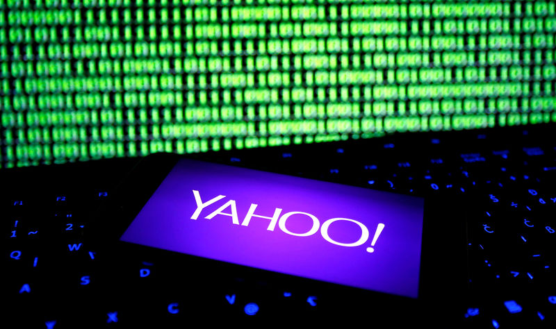 © Reuters. FILE PHOTO: A photo illustration shows a Yahoo logo on smartphone in front of a displayed cyber code and keyboard